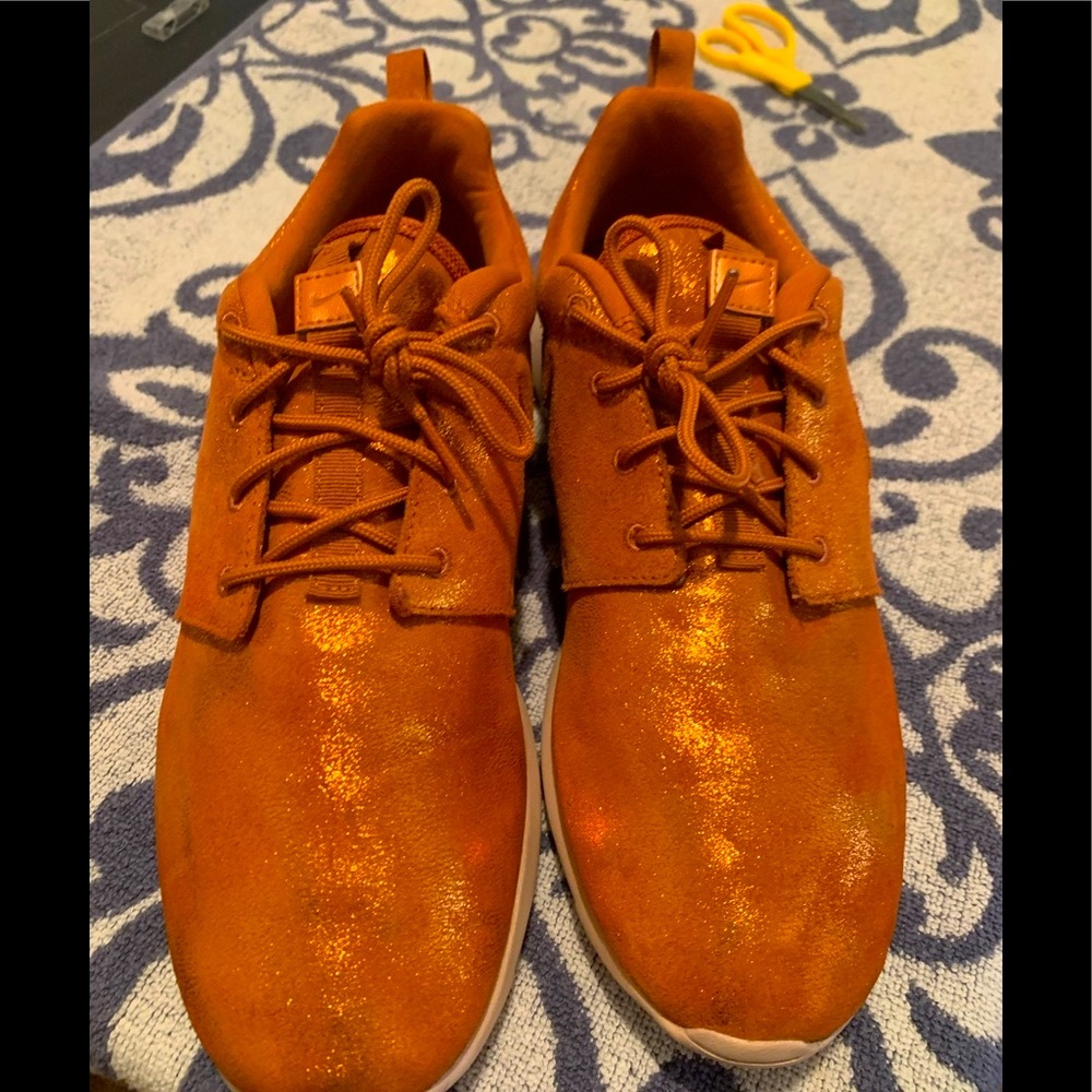 Woman’s Nike sneakers burn orange  gently used